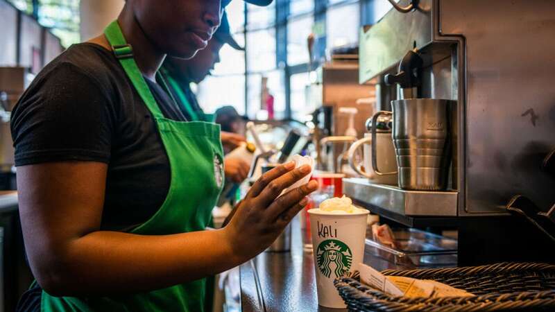 A brand new drinks menu is launching in UK Starbucks chains from April 25 (stock image) (Image: Bloomberg via Getty Images)