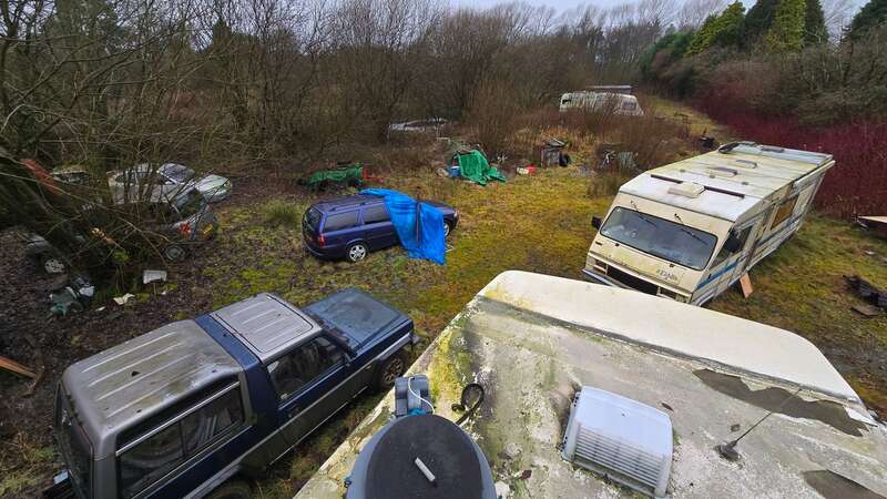 Images show two motor homes that both look lived in, left in a tragic state amongst a car collection rusting in the elements (Image: mediadrumimages/BeardedReality)