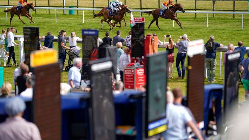 BATH, ENGLAND - AUGUST 04: Georgie Dobie riding Temple Lock (R) win The Casumo Proud To Support British Racing Handicap at Bath Racecourse on August 04, 2021 in Bath, England. (Photo by Alan Crowhurst/Getty Images)