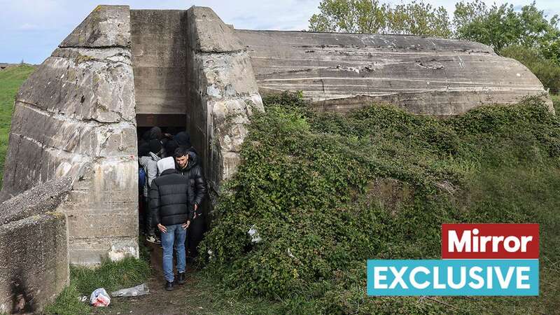 Migrants gather in German wartime bunker (Image: Humphrey Nemar /daily mirror/sunday mirror)