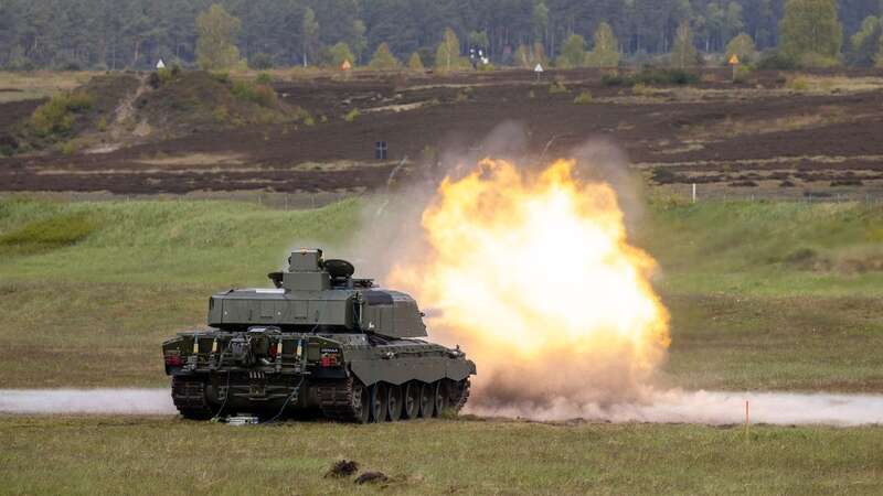 A British Army Challenger 3 Main Battle Tank fires a round during trials in Germany (Image: PO Joel Rouse/MOD/SWNS)