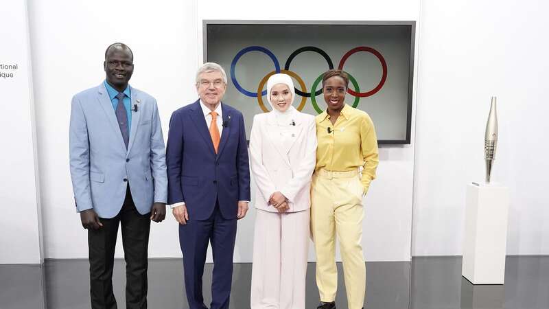 Olympic athlete Masomah Ali Zada with IOC president Thomas Bach (Image: ALAIN JOCARD/AFP via Getty Images)