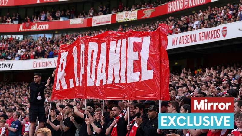 Arsenal fans hold up a banner on the 14th minute in memory of 14-year-old Daniel Anjorin (Image: PA)