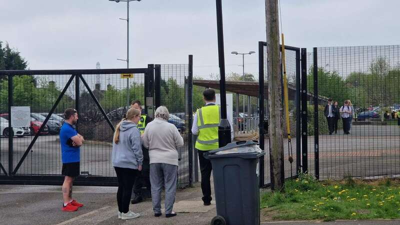 Concerned parents waiting outside Birley Academy in Sheffield (Image: Sheffield Star / SWNS)