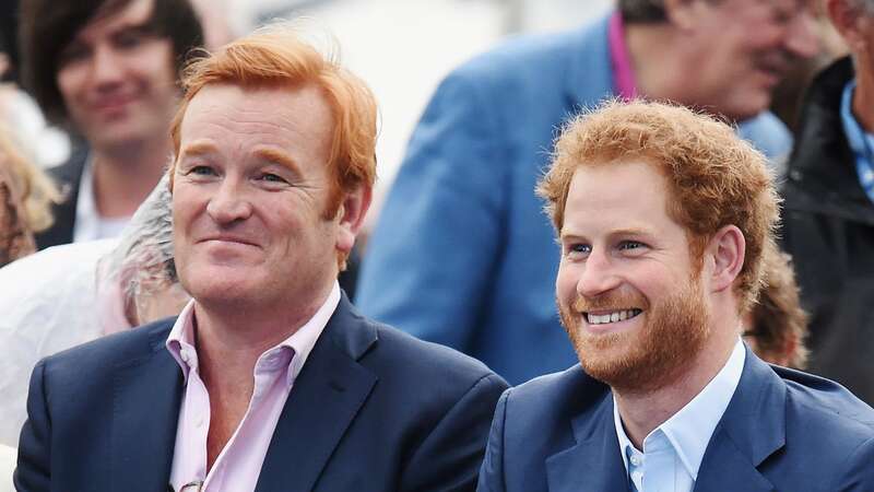 Prince Harry alongside former Royal Equerry Mark Dyer (Image: AFP via Getty Images)