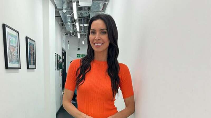 Christine Lampard styling the orange version of the M&S top that