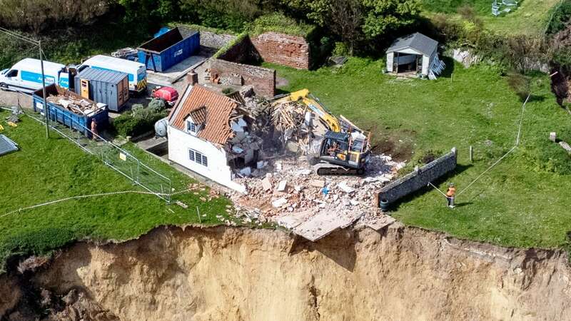 The 18th century farmhouse was left hanging perilously over a cliff edge (Image: James Linsell Clark/SWNS)