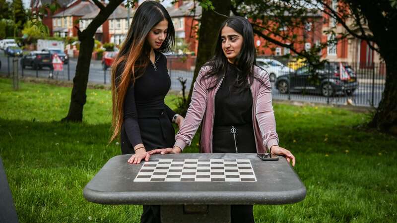 Laiba Amjad (left) and Marwa Ahmed at the controversial chess board (Image: SWNS)