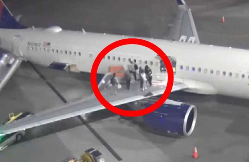 The fire sent travelers into a panic as they rushed onto the wing of the plane