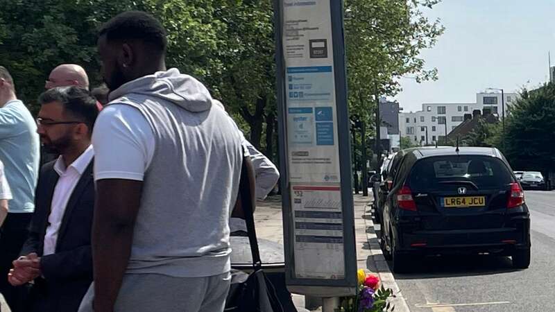 Flowers have been left at a bus stop near where Anita Mukhey was stabbed (Image: PA)