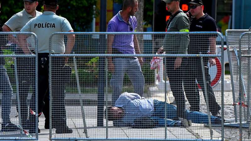 A person is detained after the shooting (Image: REUTERS)