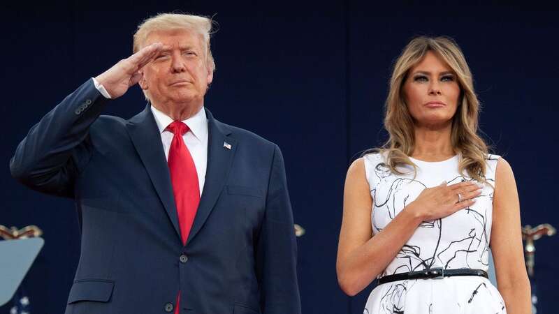 Donald Trump and Melania Trump pay their respects as they listen to the National Anthem during the Independence Day events at Mount Rushmore National Memorial in Keystone, South Dakota, in July 2020 (Image: AFP via Getty Images)