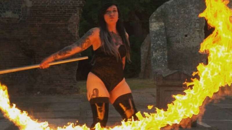 Kristy with fire in hand (Image: mediadrumimages / @kissedbyhellfire)