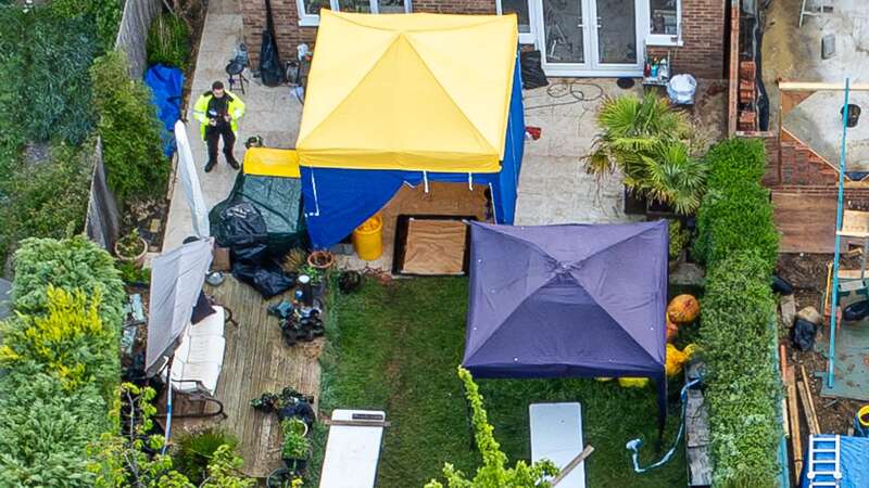 Police in the garden of the home in Caddington (Image: Marcin Nowak/LNP)