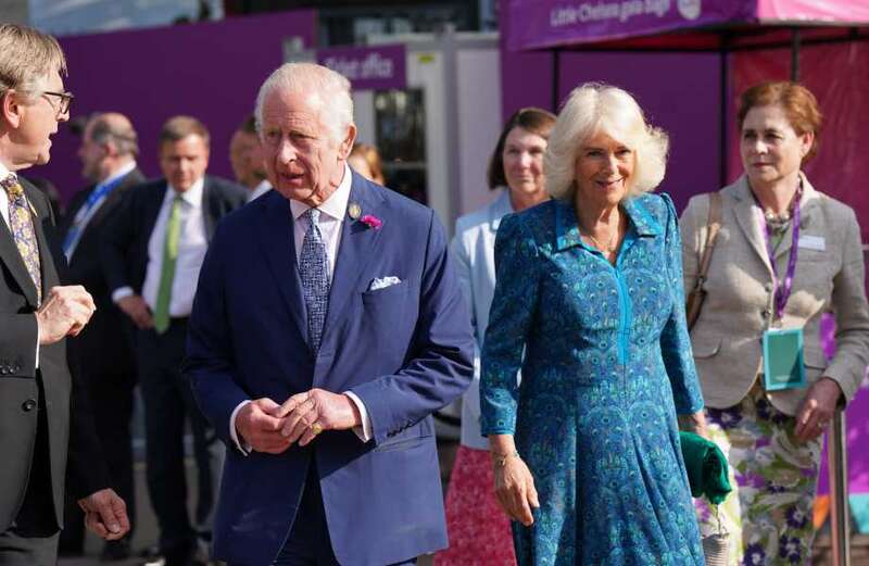 The King and Queen met a famous face while touring the gardens