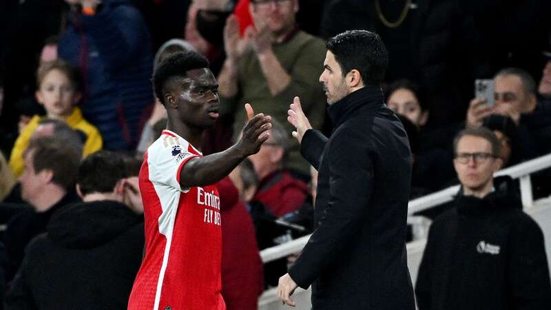 Bukayo Saka of Arsenal interacts with Mikel Arteta (Image: Shaun Botterill)