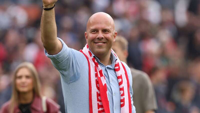 Arne Slot waves to the fans (Image: PA)