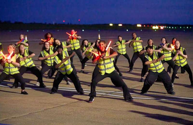 Celeb choreographer leads airport staff dance routine