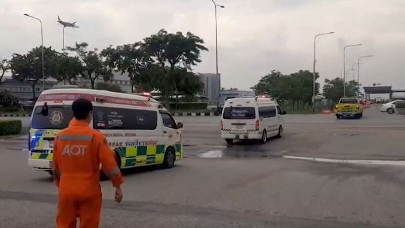 Moment emergency services swarm runway after passenger killed by turbulence