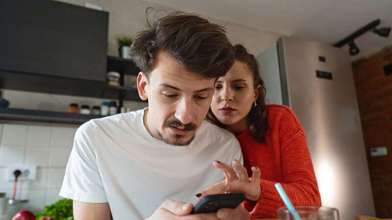 A reader is finding it impossible to have a private conversation with her brother (Image: Getty Images)