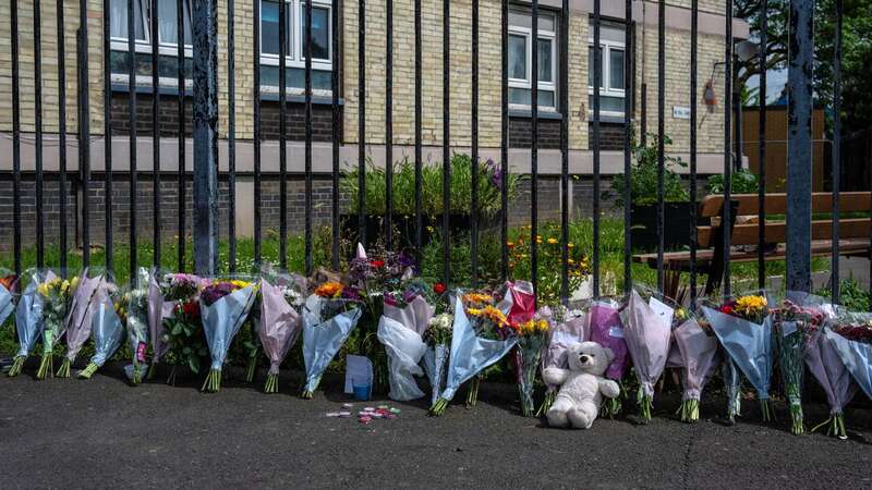 Flowers left at the scene at Jacobs House in Plaistow, London, where five-year-old Aalim Ahmed died in a tragic fall (Image: Getty Images)