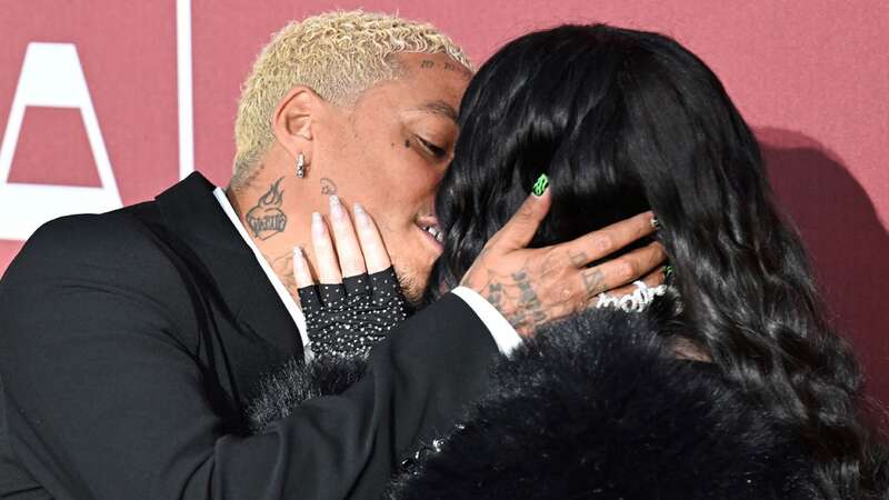 Cher and Alexander Edwards locked lips on the red carpet