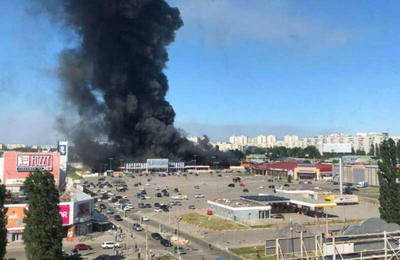 Watch as Sun Man Paul Sims witnesses the horror scenes at the burning shop in Kharkiv