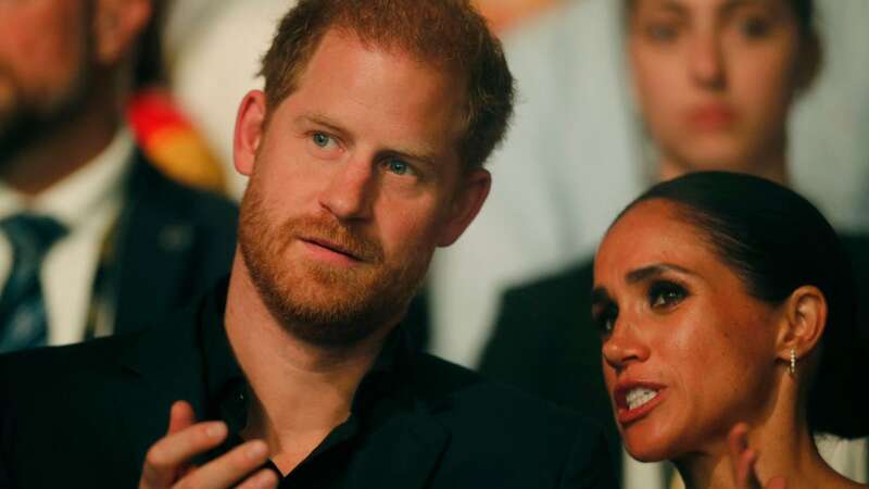 Prince Harry and Meghan Markle have been given a stark warning (Image: AFP via Getty Images)