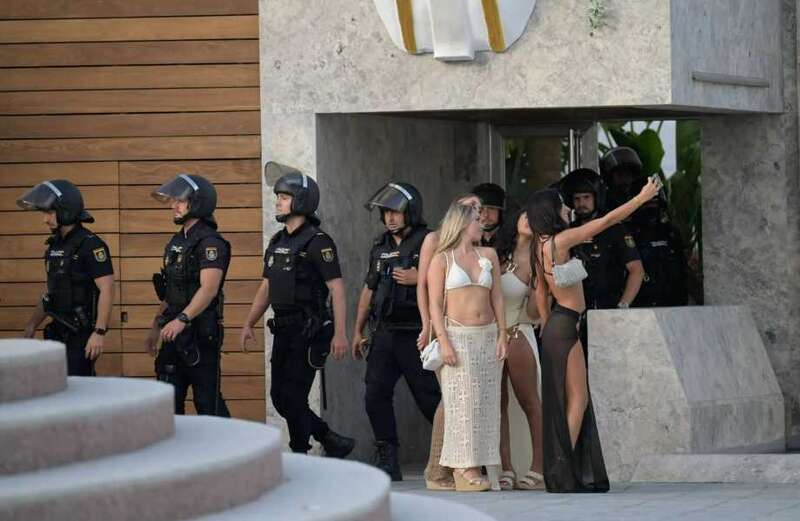 The chilling footage shows nearly 20 heavily-armed police ordering revellers out of the pool during the broad-daylight raid