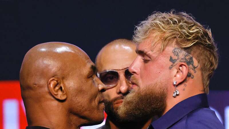 Mike Tyson faces off with Jake Paul (Image: AFP via Getty Images)