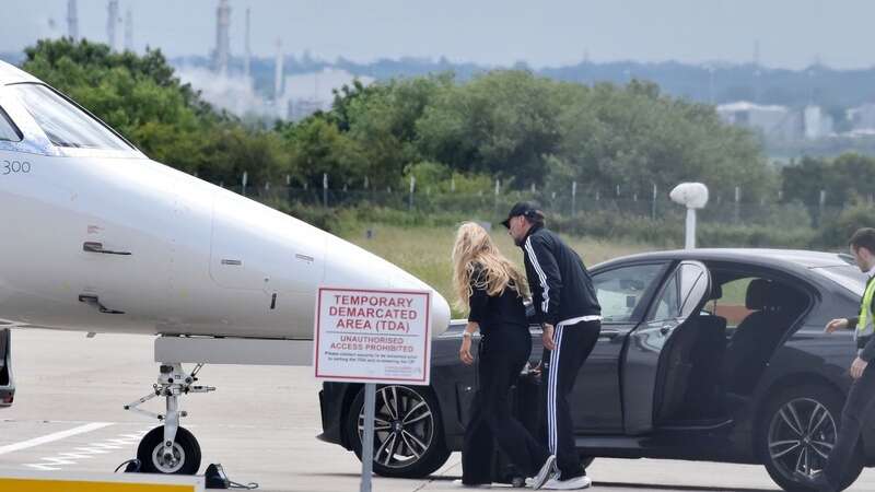 Jurgen Klopp and wife Ulla Sandrock board a private jet at a Liverpool airport (Image: DANNY RYAN / BACKGRID)