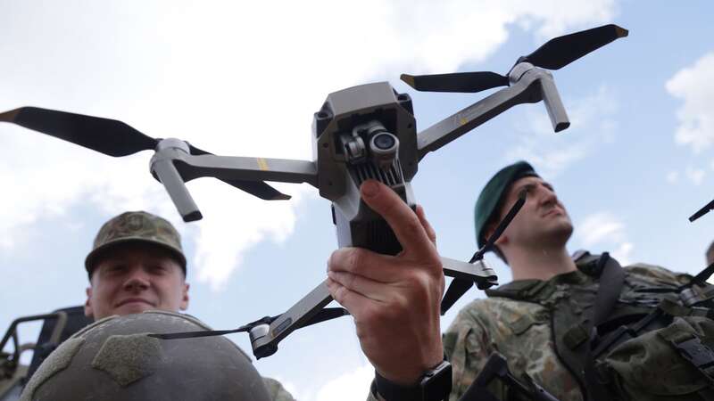 Lithuanian troops stand with their DJI drones at the Quadriga military exercises involving German, French, Dutch and Lithuanian troops (Image: Getty Images)