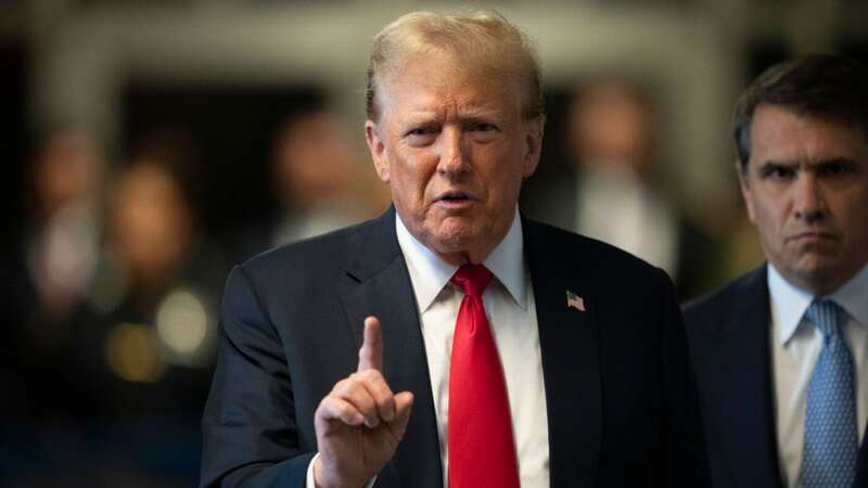 Former US President Donald Trump, left, and Todd Blanche, attorney for former US President Donald Trump, speak to members of the media while arriving at Manhattan criminal court (Image: Bloomberg via Getty Images)