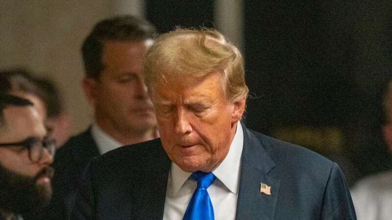 Republican presidential candidate Donald Trump walks to speak to the press after he was convicted in his criminal trial at Manhattan Criminal Court (Image: POOL/AFP via Getty Images)