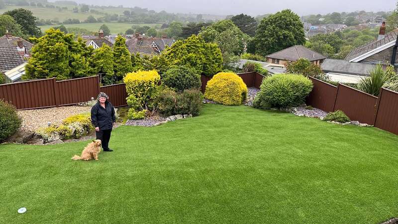 Val Starbuck with her sinking garden (Image: IOW County Press/Solent News)