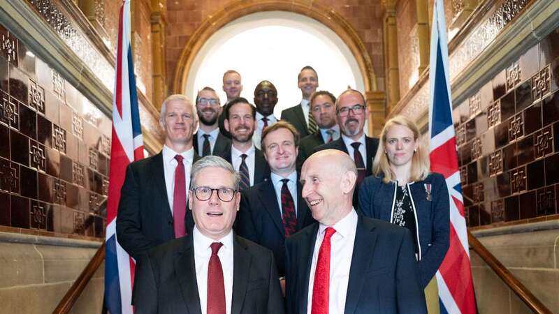 Keir Starmer with 10 of the 14 military veterans standing for Labour at the General Election (Image: PA)