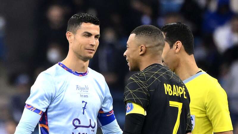 Cristiano Ronaldo chats with Kylian Mbappe (Image: FRANCK FIFE)