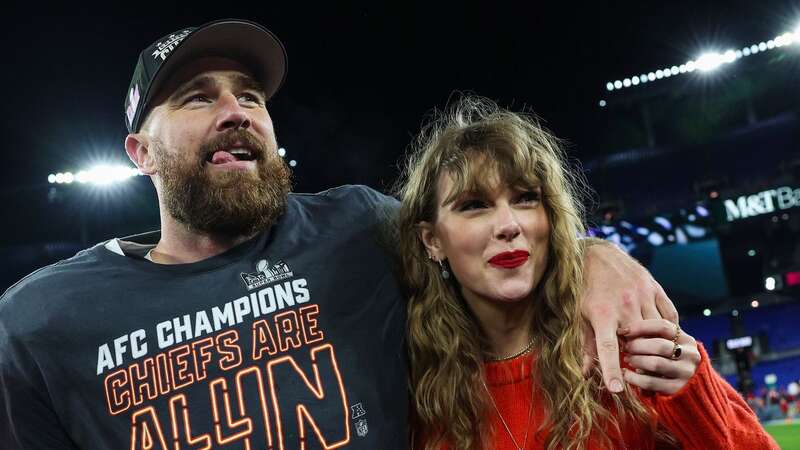 Taylor Swift was by Travis Kelce