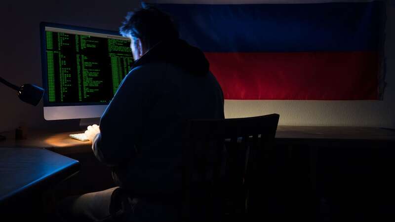 A hacker works on a computer in a darkened room (file image) (Image: Getty Images)