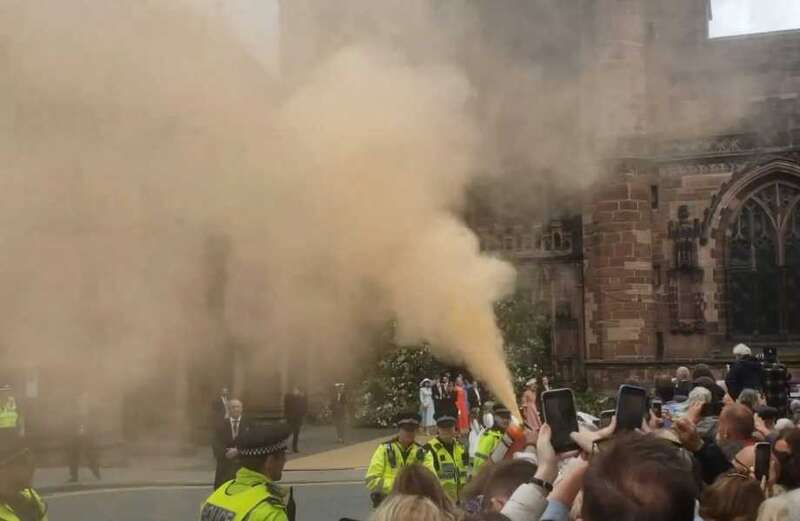 A woman was removed from the crowd by police