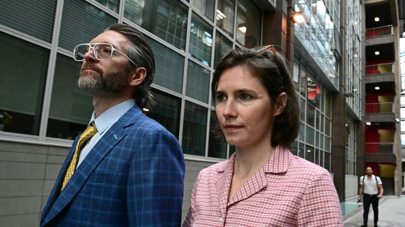 Amanda Knox arrives with her husband Christopher Robinson at the courthouse in Florence (Image: AFP via Getty Images)