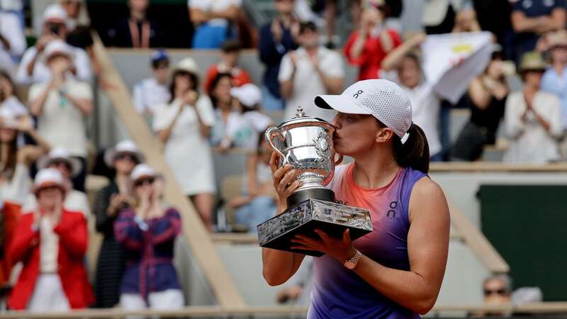 Iga Swiatek of Poland hold the cup after winning against Jasmine Paolini (Image: Anadolu via Getty Images)