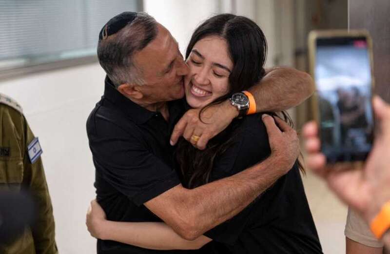 Noa has now been pictured reunited with her dad Yaakov back in Israel following a daring rescue mission on Saturday morning