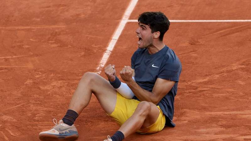 Carlos Alcaraz of Spain celebrates winning the men