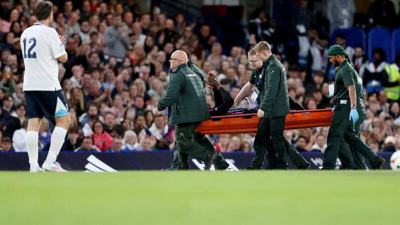 Usain Bolt of World XI is carried off on a stretcher (Image: Henry Browne)