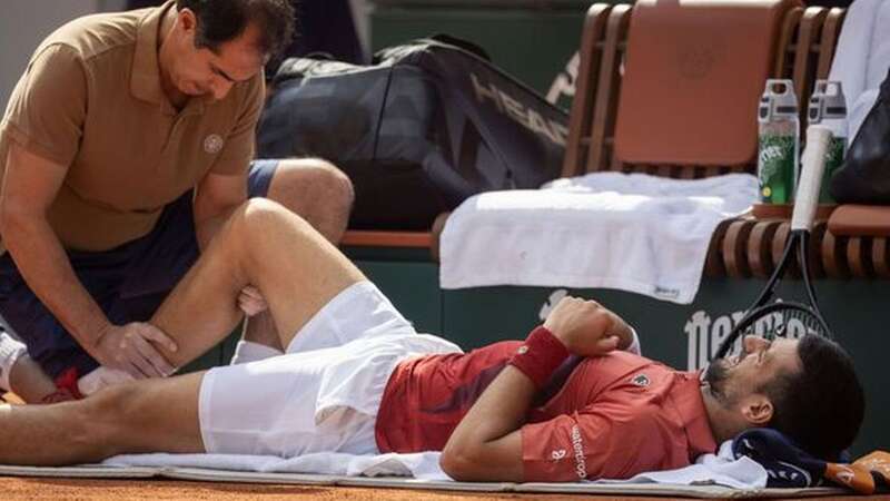 Novak Djokovic faces missing Wimbledon after suffering a knee injury at the French Open (Image: Getty)