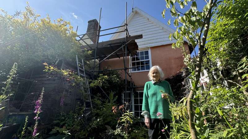 Gill Hayes-Newington pictured in front of her neighbour