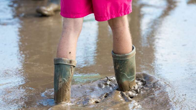 Wellies are likely to be essential for those heading to Glastonbury (Image: Getty Images Europe)