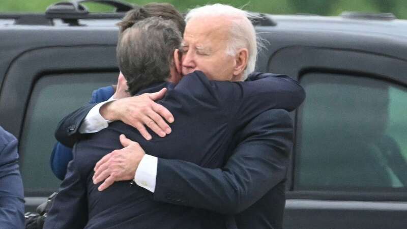 US President Joe Biden hugs his son Hunter Biden upon arrival at Delaware Air National Guard Base in New Castle, Delaware (Image: AFP via Getty Images)