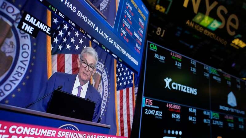 A screen displays a news conference with Federal Reserve Chairman Jerome Powell on the floor at the New York Stock Exchange (Image: Copyright 2024 The Associated Press. All rights reserved.)